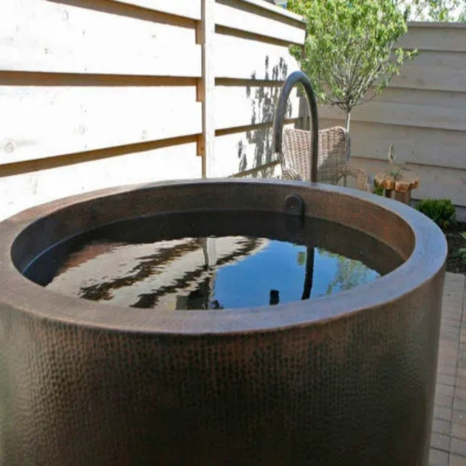Coppersmith Creations 45-inch Hammered Antique Japanese Style Soaking Copper Bathtub in garden setting