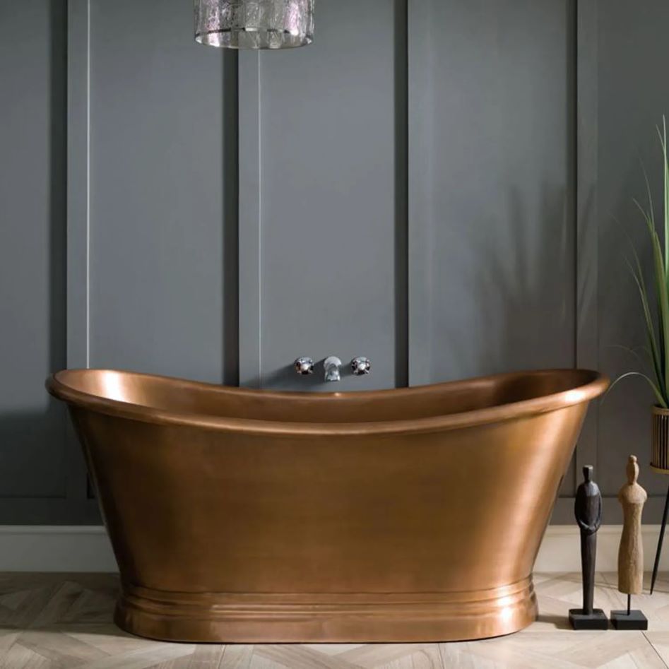 Coppersmith Creations Slanted Cascading Base Copper Bathtub Full Antique Finish installed in home with dark background